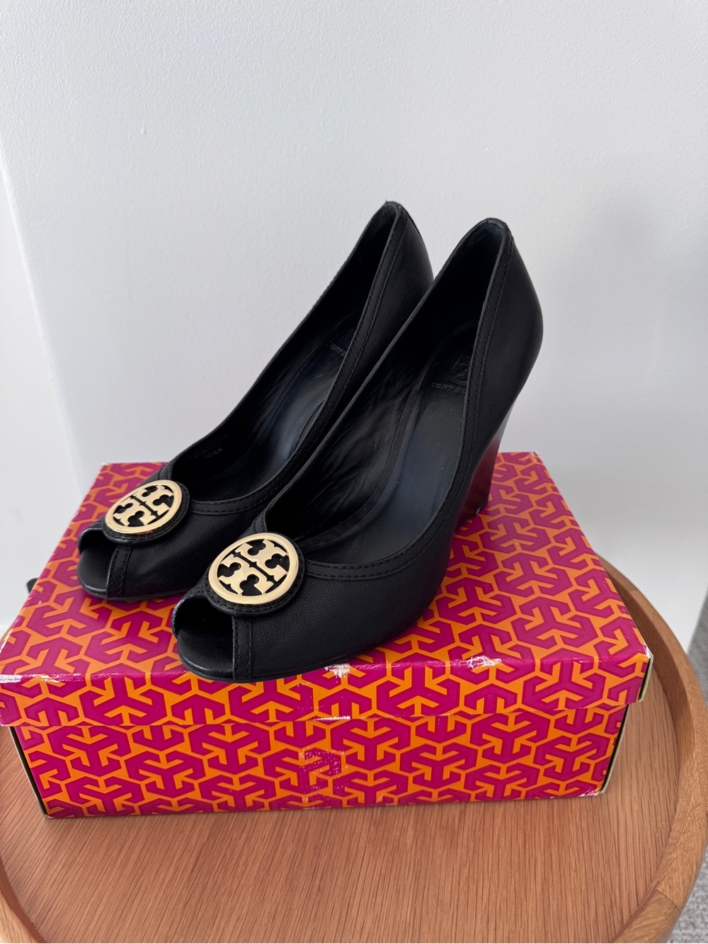 Tory Burch Black Peep-Toe Wedge Pumps with Gold Logo Medallion